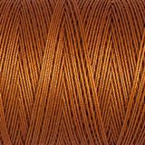 Close-up of brown thread with a textured pattern